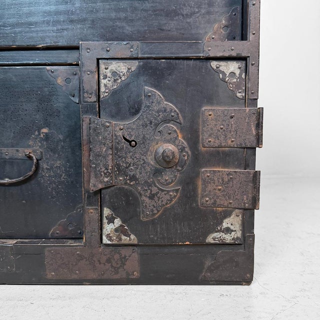 This compact Japanese tansu cabinet is a remarkably practical storage piece with a calm, dark appearance. Dimensions:...
