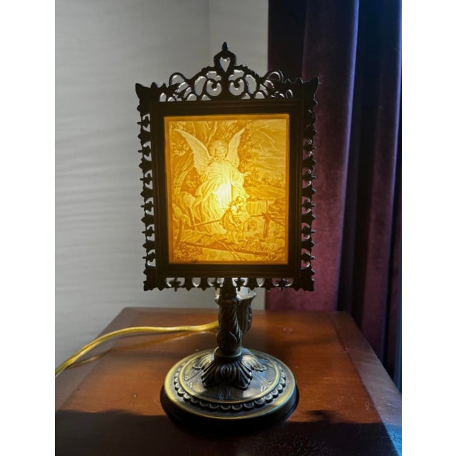 Guardian Angel lithophane Victorian accent lamp featuring a translucent porcelain panel illuminated from behind.Features a...