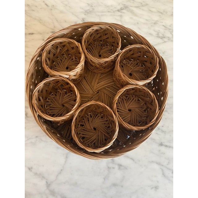 Gorgeous vintage Italian wicker beverage set featuring 6 glass holders which are presented within a matching tray basket,...