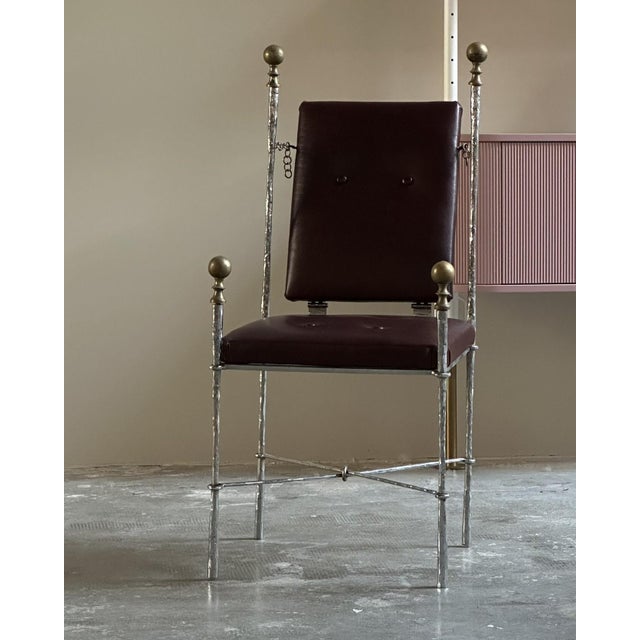 A pair of chairs created by designer-sculptor Felix Agostini in 1969, France. The frame is made of hammered chromed iron,...