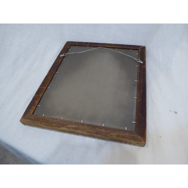 This silverleaf mirror has a distressed finish and measures 18.5"H x 15.5"W.