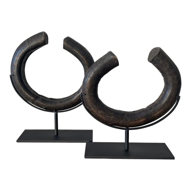 A Pair of Antique African Bronze Ngelima Mounted Currency Bracelets For Sale