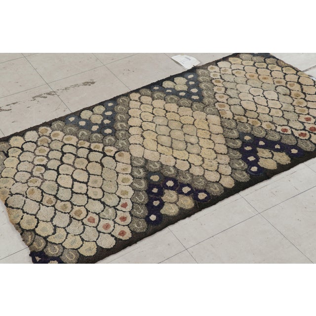 Handmade in wool and originating circa 1920-1930, this 3x5 rug is a rare and exciting new curation in Rug & Kilim’s...