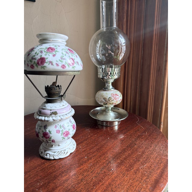 Mid-century hurricane style oil lamp with mixed ceramic, metal, and glass construction. White ceramic reservoir with hand-...