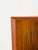High-quality and timeless teak bookcase with four shelves, each with a beveled front. The second shelf from the bottom is...
