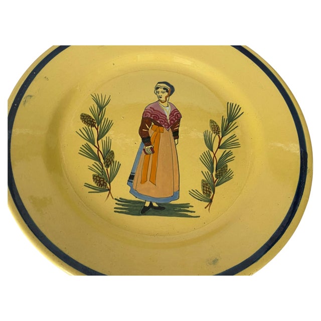 Yellow plate in Faience. It has been made in France in the 10th century. It is hand painted. with Olive and a cricket...