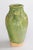 A superb 19th century French Provençal green glazed terracotta olive jar or urn. These jars were used for storing and...