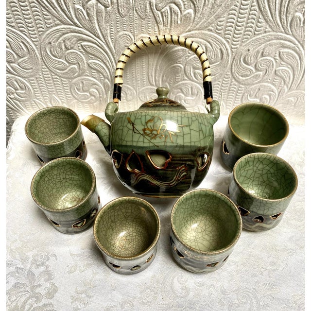 A most unique vintage MCM 1960’s double wall crackle glaze pottery Japanese reticulated hearts tea set which includes the...