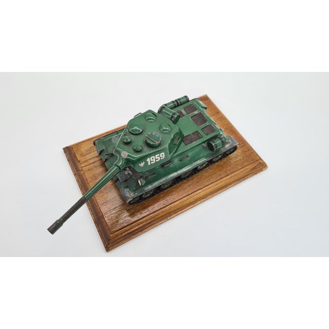 A solid, collectible model of a tank, made entirely of metal, on a wooden display base. The model is heavy, massive, and...