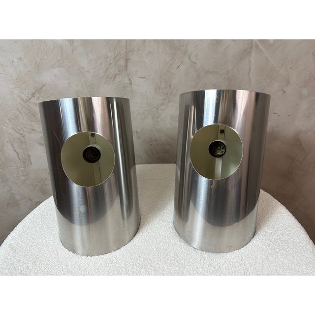 Stunning pair of 1970s wall sconces with a clean, resolutely modernist design, typical of the Space Age/late Mid-Century...