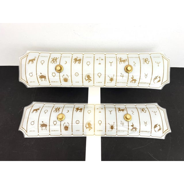 Big beautiful pair of 1970s frosted glass astrological wall lights or sconces reverse painted with the twelve signs of the...