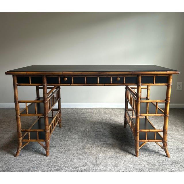 Stylish English Chinoiserie style faux bamboo desk by Milling Road for Baker, featuring an elegant bamboo-form frame with...