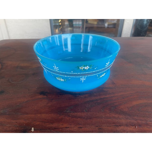This item is a antique French Blue Opaline Glass Bowl featuring delicate, hand-painted enameled floral details and white...