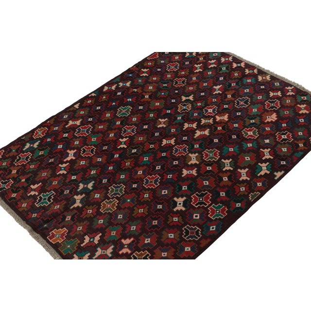 Hand knotted in wool, this 6x8 Baluch rug represents a new line of tribal carpets in the Modern Classics Collection by Rug...