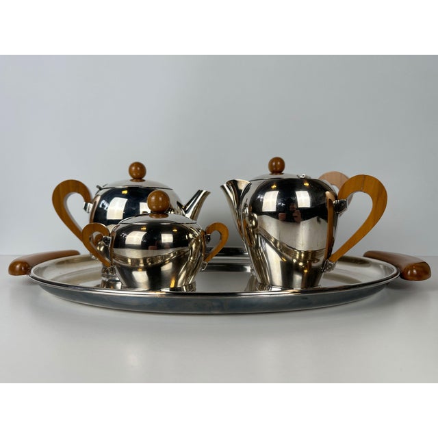 Vintage Alessi coffee and tea set on a saucer. Silver-plated. Bombé. Carlo Alessi. Italy. Consisting of: coffee pot with...