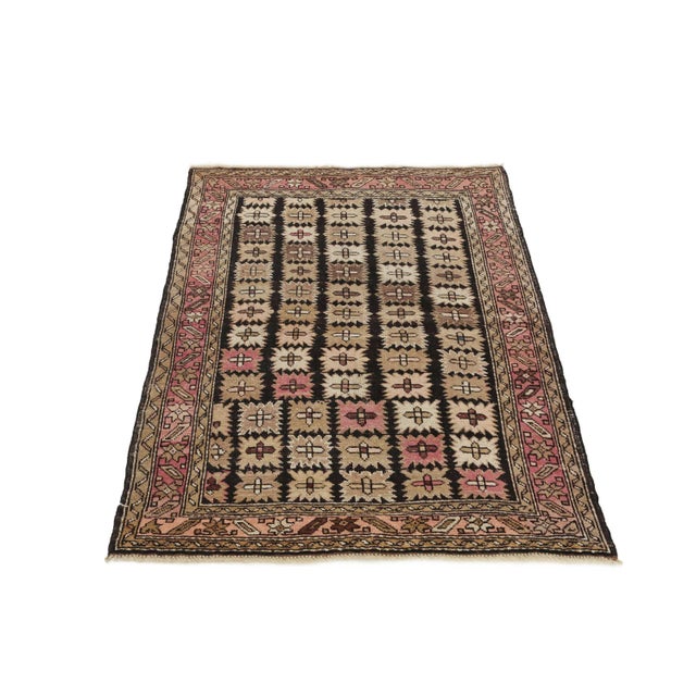 Decorative handknotted antique Caucasian wool rug. Approximately 70-80 years old. In very good condition.