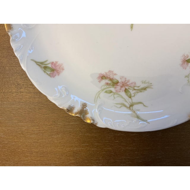 An exquisite late 19th-century French Limoges porcelain plate by Haviland & Co. Crafted from fine white porcelain, this...