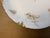 An exquisite late 19th-century French Limoges porcelain plate by Haviland & Co. Crafted from fine white porcelain, this...