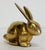 Vintage brass bunny seated with ears perked. Would make a great paper weight or decorative accessory. Patina.