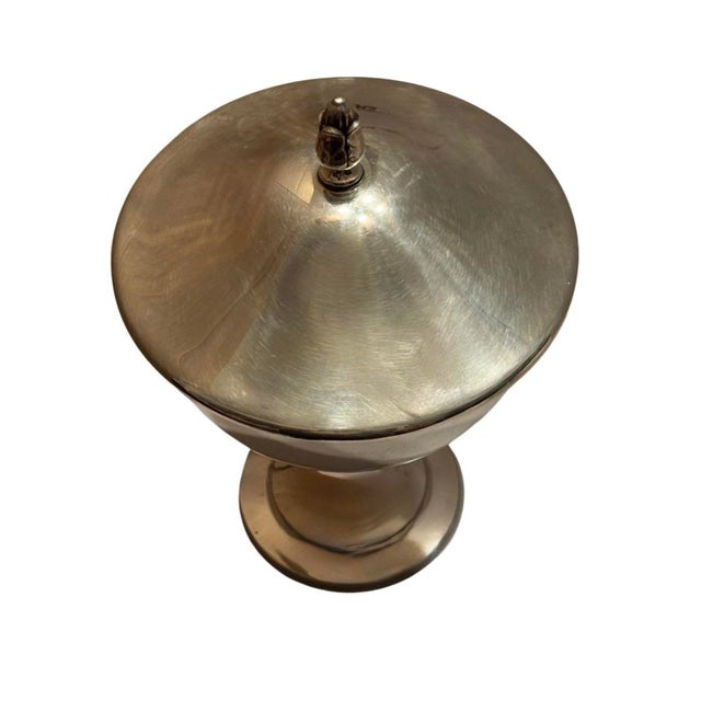 Made by Oneida, this silver plate covered compote makes for a stately candy dish. The footed base has decorative rings at...