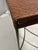 Woven rattan over an iron frame, this table was.purchased from the Conran Shop in Georgetown, DC, in 1990. Frame has a...