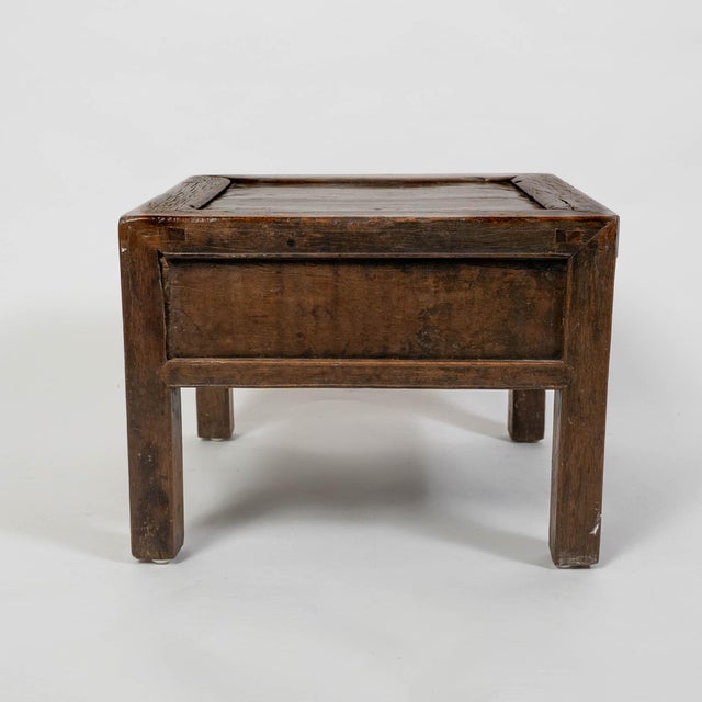 A beautiful 19th-century Chinese side table or stool from Shanxi Province, crafted from richly patinated walnut wood and...