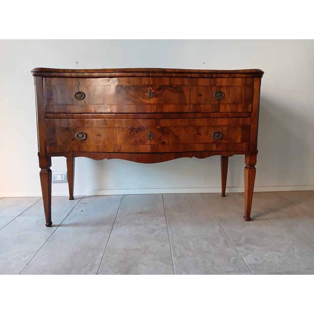 Elegant two-drawer chest of drawers inlaid in walnut. The top, front, and apron are curved in the Louis XV style, but the...