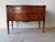 Elegant two-drawer chest of drawers inlaid in walnut. The top, front, and apron are curved in the Louis XV style, but the...