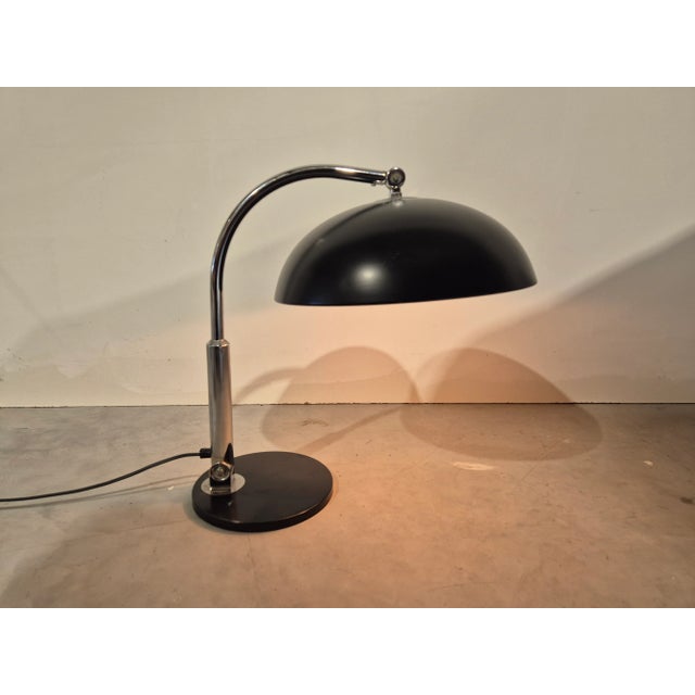 This lamp is a design classic and this black version is incredibly stylish This piece has an attribution mark, I am sure...