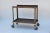 Sturdy industrial bar cart on wheels. Also great as an industrial console in the kitchen or anywhere else in the house.