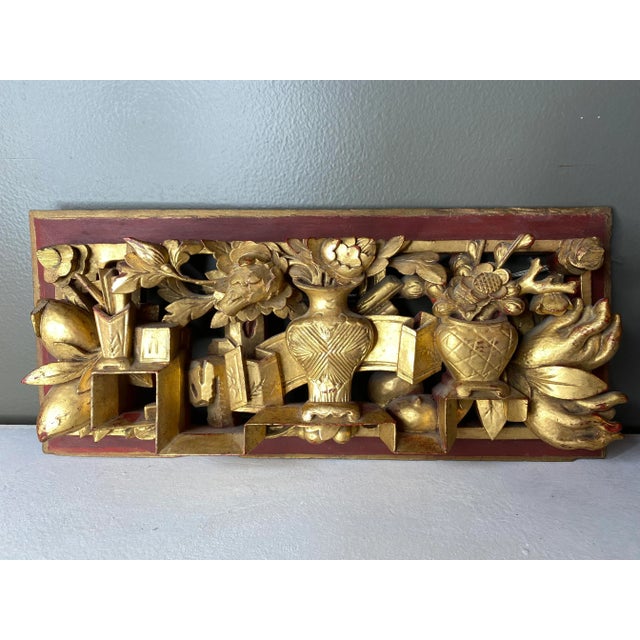 Great looking antique Asian hand carved chunky panel decorated with red boule under-paint and heavy coating of gilt atop,...