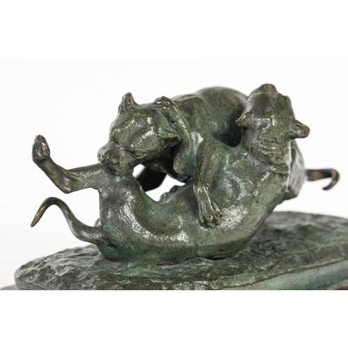 Bronze sculpture of two dogs playing on a marble base, 19th century, napoleon iii period. A 19th century napoleon iii...