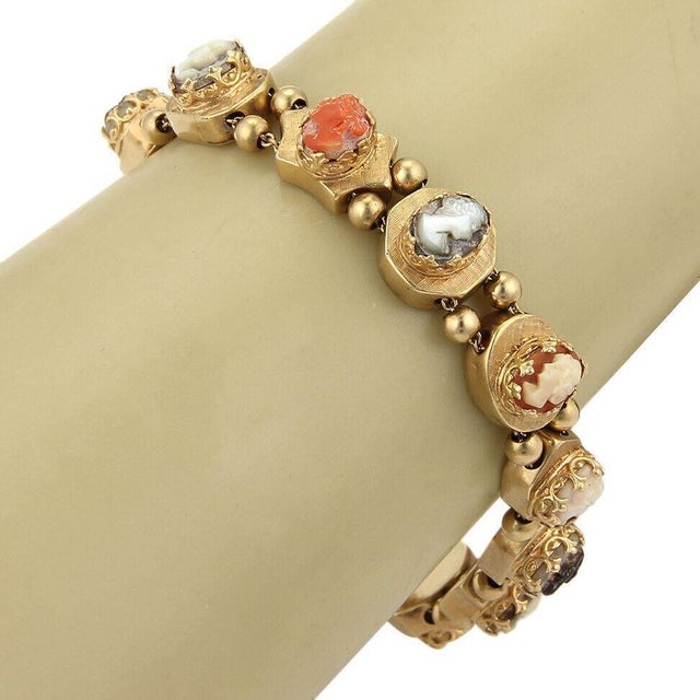 his authentic vintage slide bracelet is crafted in solid 14k yellow gold and features a beautiful assortment of gemstone...