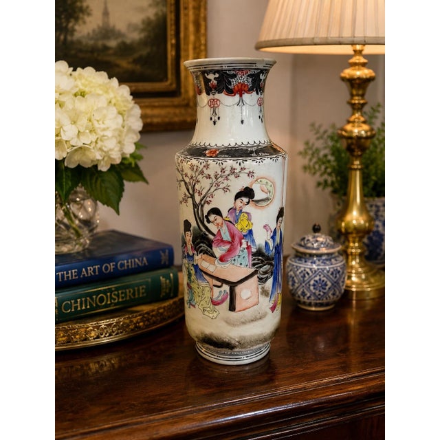 An elegant vintage Chinese porcelain vase executed in the famille rose tradition, featuring beautifully hand-painted...