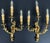 A striking pair of Vintage French sconces featuring elegant three arm styling with beautifully flowing decorative forms...