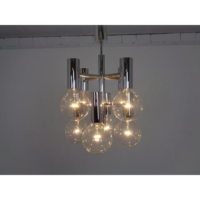 Chrome-plated Italian Space Age ceiling lamp from the 1960s. 8 burning points. Two (25 watt) replacement bulbs are...