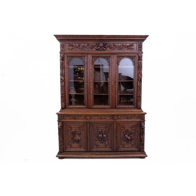 This carved bookcase/sideboard, originating from France and dating to around 1880, is a Neo-Renaissance piece featuring...