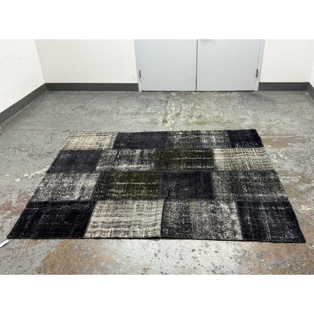 Design Plus Gallery presents a 6ft X 7ft 9in Turkish Patch Work Hand Woven Area Rug. This Turkish hand-knotted rug was...