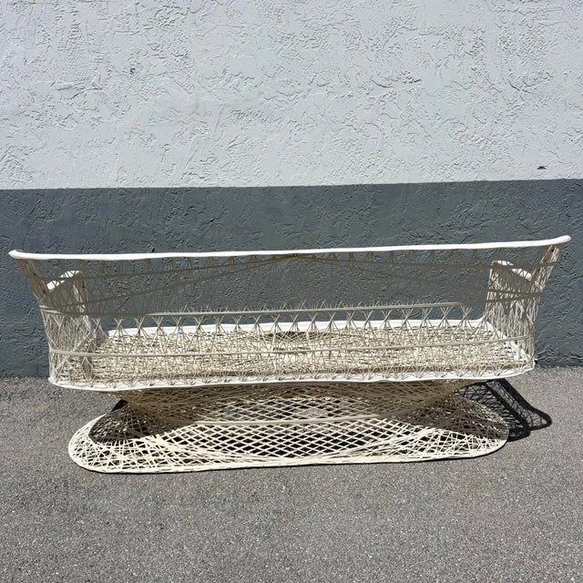 A bold and sculptural statement piece, this mid-century modern spun fiberglass sofa captures the era’s fascination with...