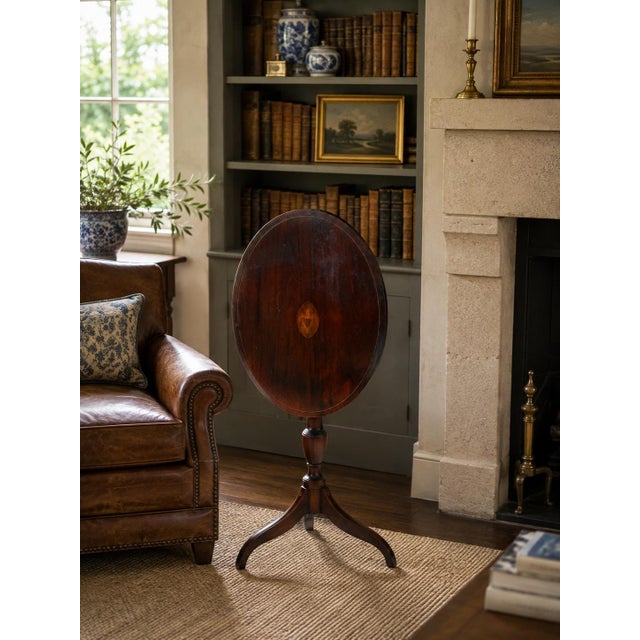 A handsome 1938 American Federal-style tilt-top table from the American Museum Collection, reproduced after a Sheraton-...