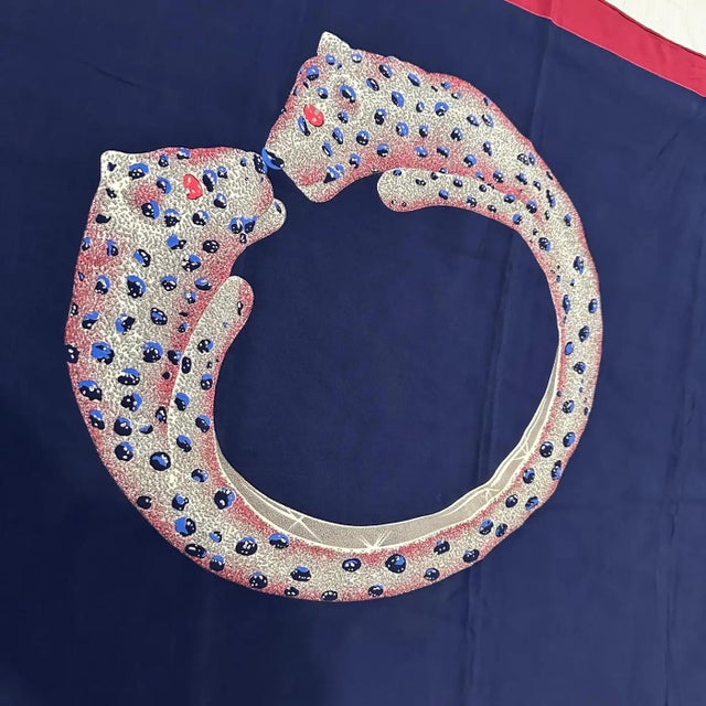 This scarf, an exquisite creation from Cartier in the 1990s, showcases the brand's dedication to luxury and design. The...