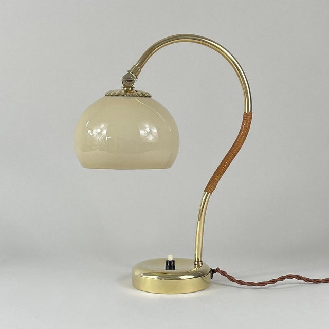 This elegant minimalist table lamp was designed in Finland in the 1950s by Mauri Almari and produced by Idman Oy (signed)....