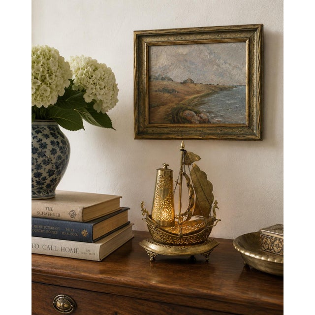 An unusual and beautifully detailed mid-20th century German brass sailing ship nightlight that effortlessly bridges...