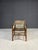 A vintage armchair from the 1960s, made in former Czechoslovakia. It features a solid wooden frame and a striking macramé...