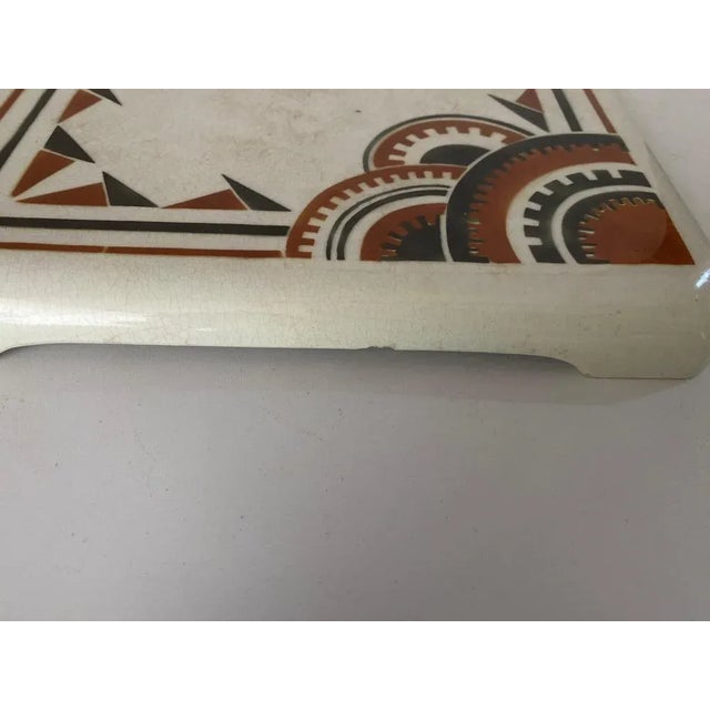 This is a trivet in ceramic, with Art Deco decoratives Patterns. It has been done Circa 1940 byLuneville K&G, it is...