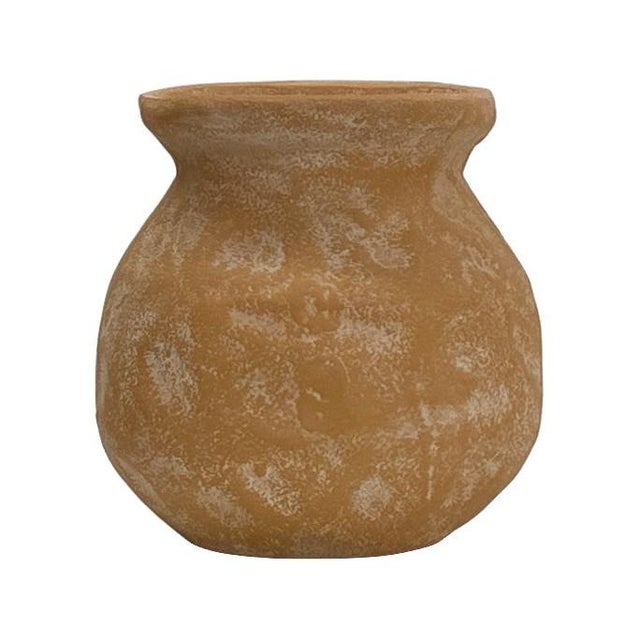 Its rounded body and flared neck create a bold, balanced silhouette that feels both collected and curated. The warm,...