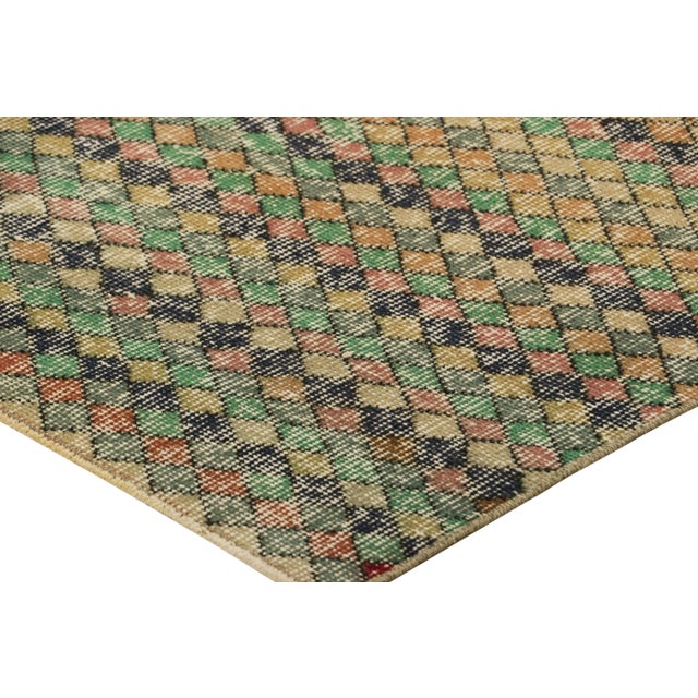 Made with hand-knotted wool in Turkey circa 1960-1970, this 3x6 vintage runner rug is an exciting new addition to Rug &...