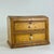 An elegant and unique two drawer antique cabinet with a treasure chest dome top. It's a character piece that's both...