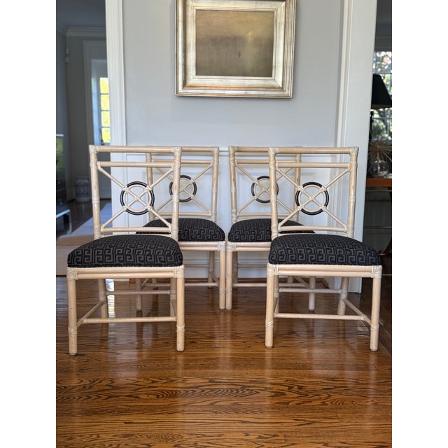 Set of four rattan side chairs or dining chairs designed by breakthrough innovator Elinor McGuire in the California...