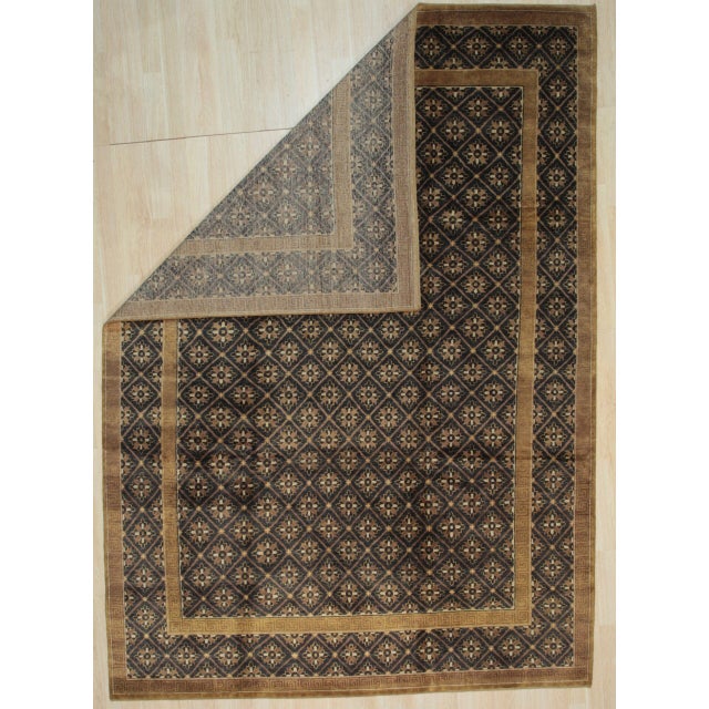 Bespoke Vibrant Brown Hand Knotted Wool Rug, Country of Origin: China. This exquisite piece showcases the refined...